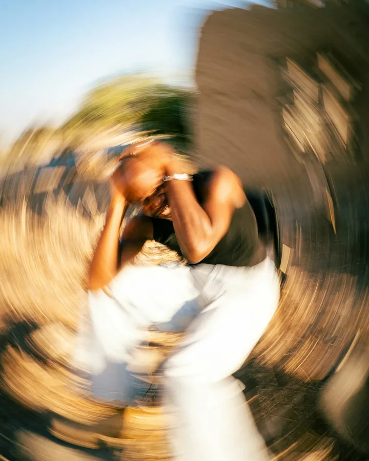 Stylised motion-blurred photograph evoking the spin of anxiety and overwhelm.