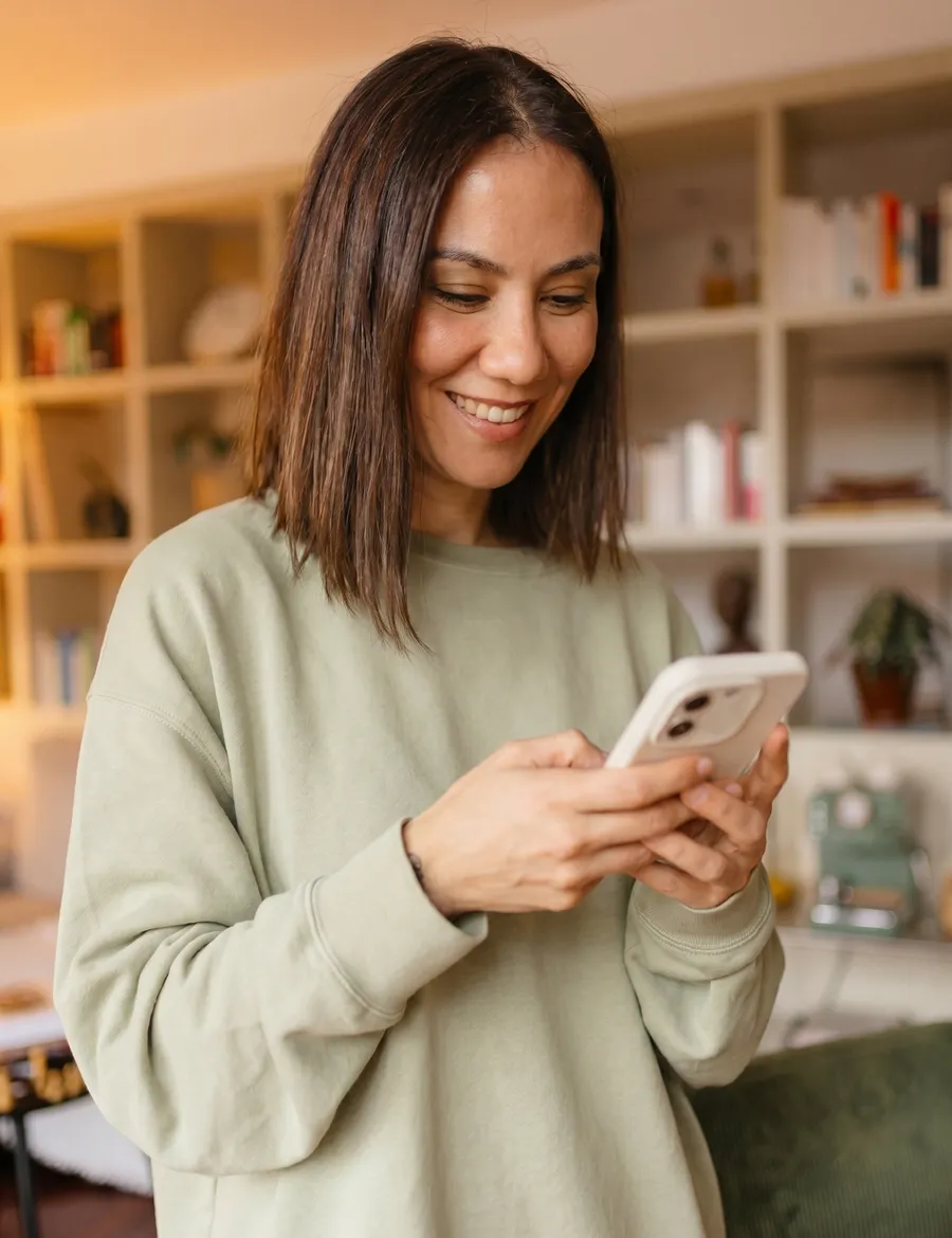 A patient at home using the Telehealthy app on her phone